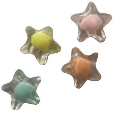 Photo of four plastic beads shaped like stars. Each one is clear with a different colored ball in the center